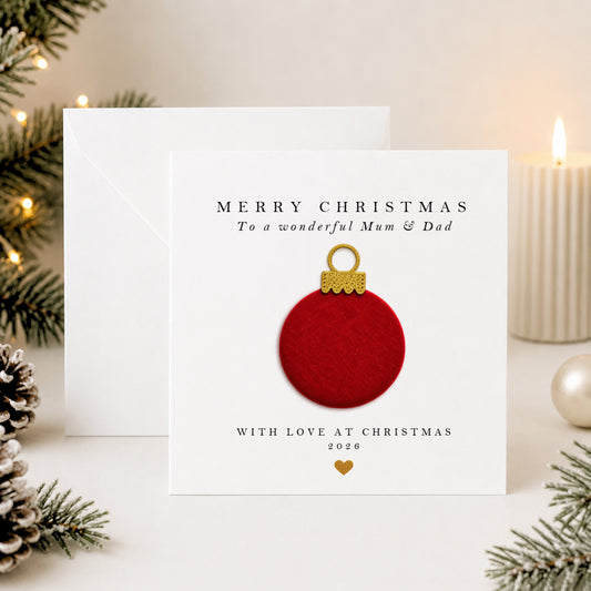 Personalised Mum and Dad Christmas card with hand-applied red velvet bauble on white card — luxury handmade design by Whisk & Whirl Designs