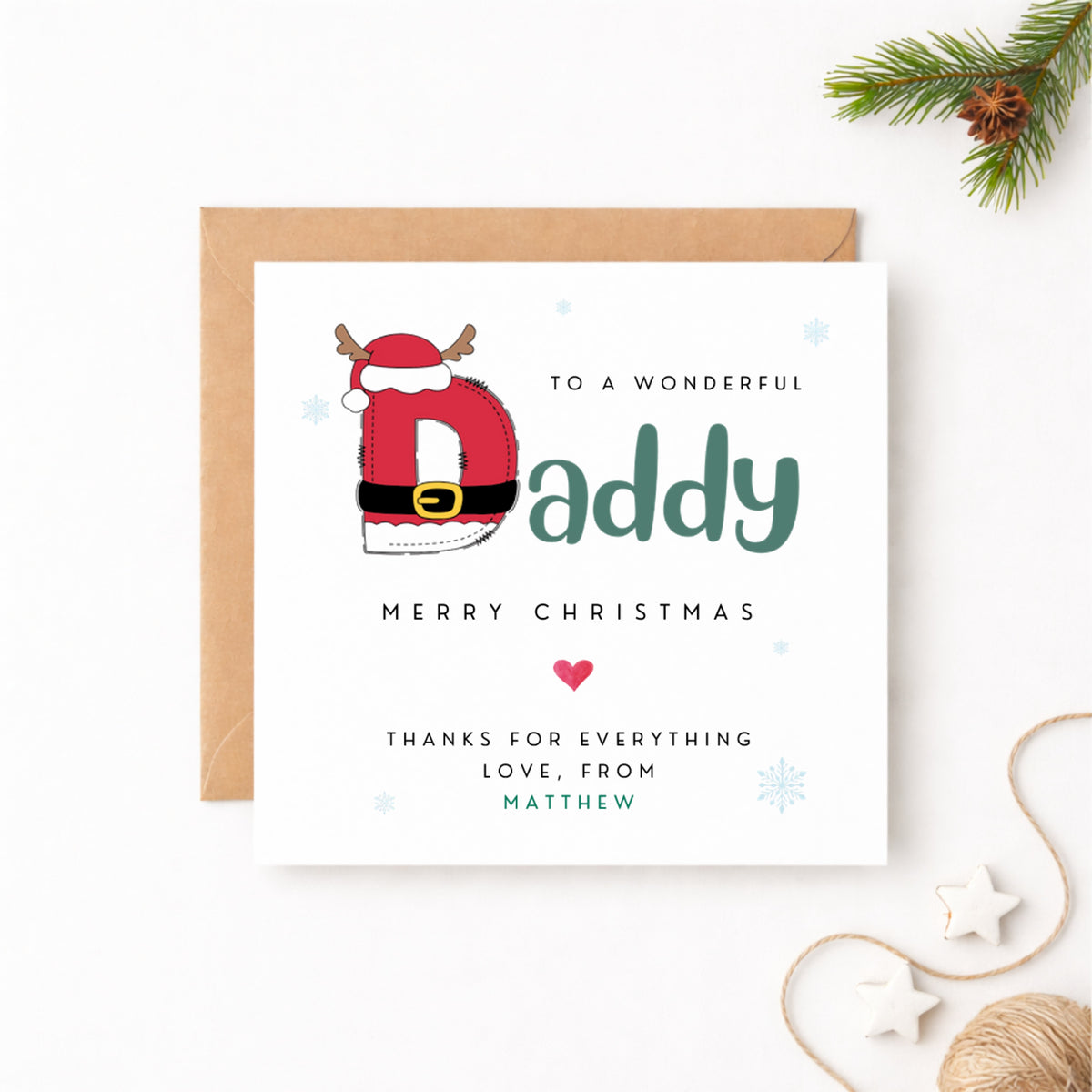 Personalised Christmas card for Daddy featuring an illustrated Santa letter D with reindeer antlers, personalised with the name Matthew in green