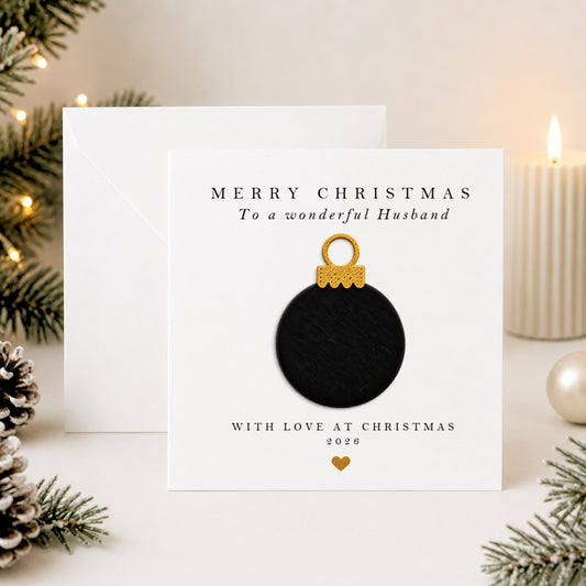 Personalised husband Christmas card with hand-applied black velvet bauble on white card — luxury handmade design by Whisk & Whirl Designs