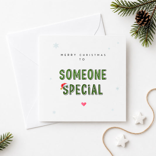 Merry Christmas to Someone Special card featuring bold green lettering with a Santa hat, snowflake details and a pink heart, sent with a white envelope